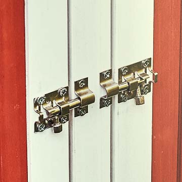 Closeup of metal latches on doors, locked in place